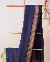 Navy blue Bengal cotton saree body close up highlighting fabric texture and border
