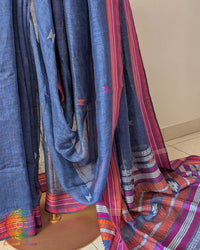 Pleats detail of blue linen saree showing texture and structured drape