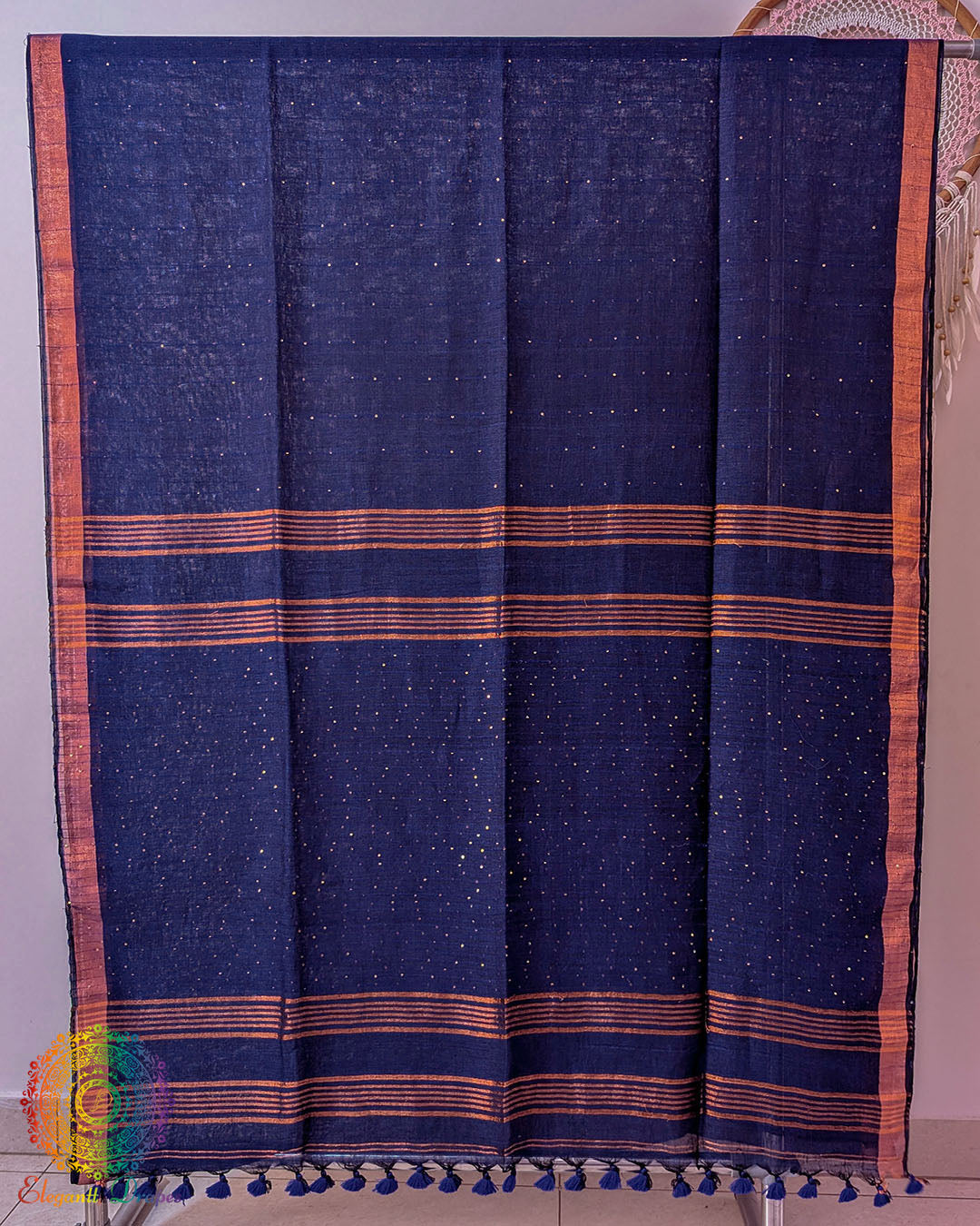 Full navy blue linen saree laid open showing overall design and layout