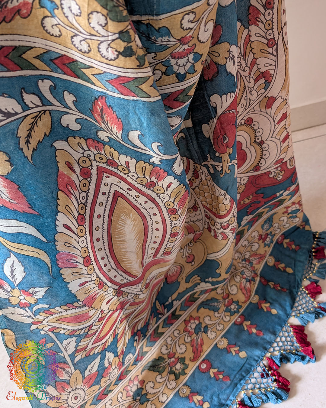 Detailed view of the handcrafted Bandhani and Kalamkari artistry on the Blue Muga Silk Saree