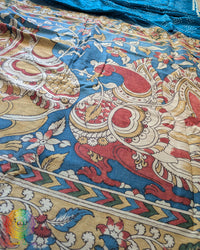 Close-up of the intricate Kalamkari motifs on the Blue Bandhani Muga Silk Saree