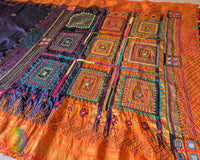 Intricate Lambani hand embroidery detail on blue silk saree