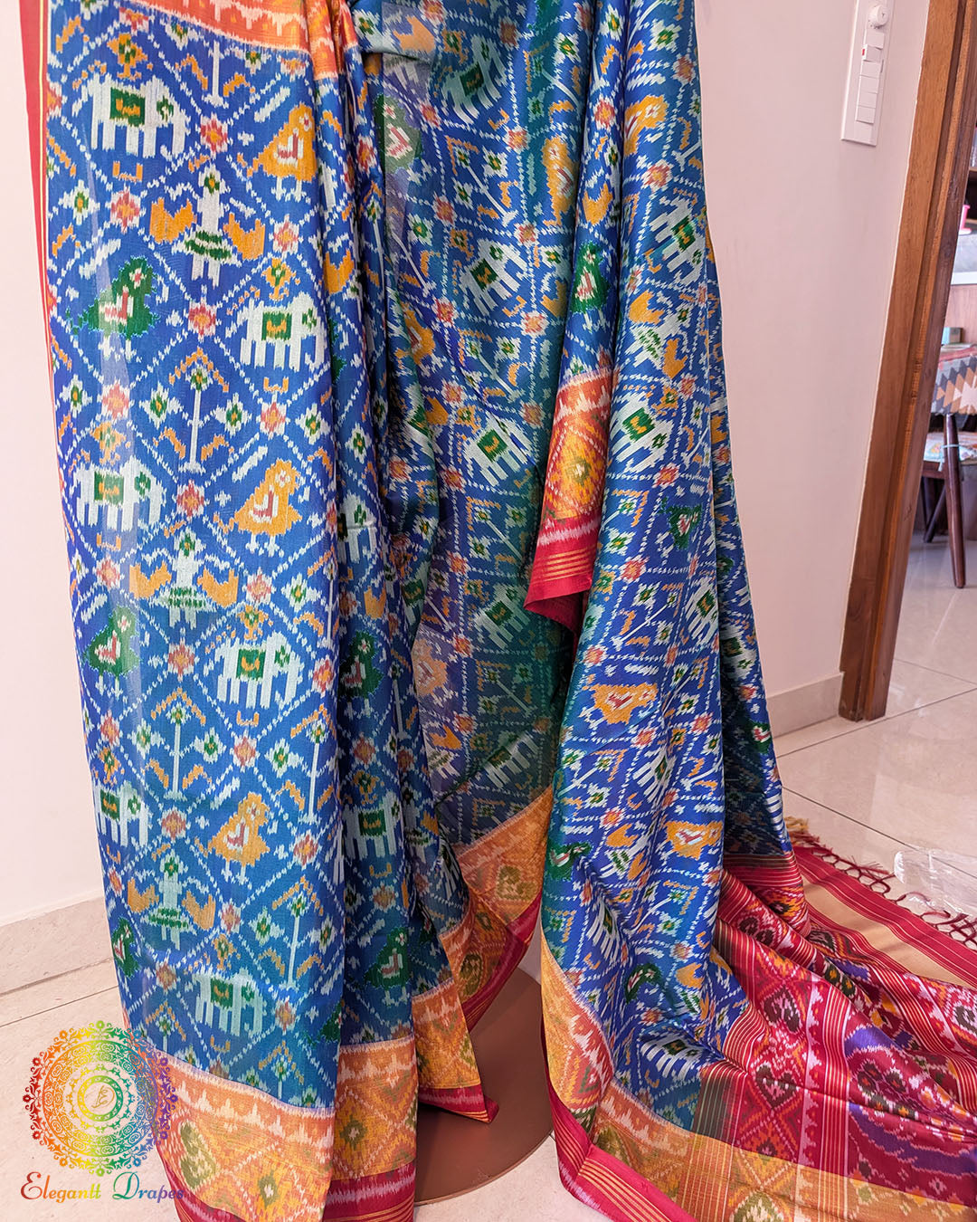 Close up of blue patola silk saree showing single ikkat weave and motifs