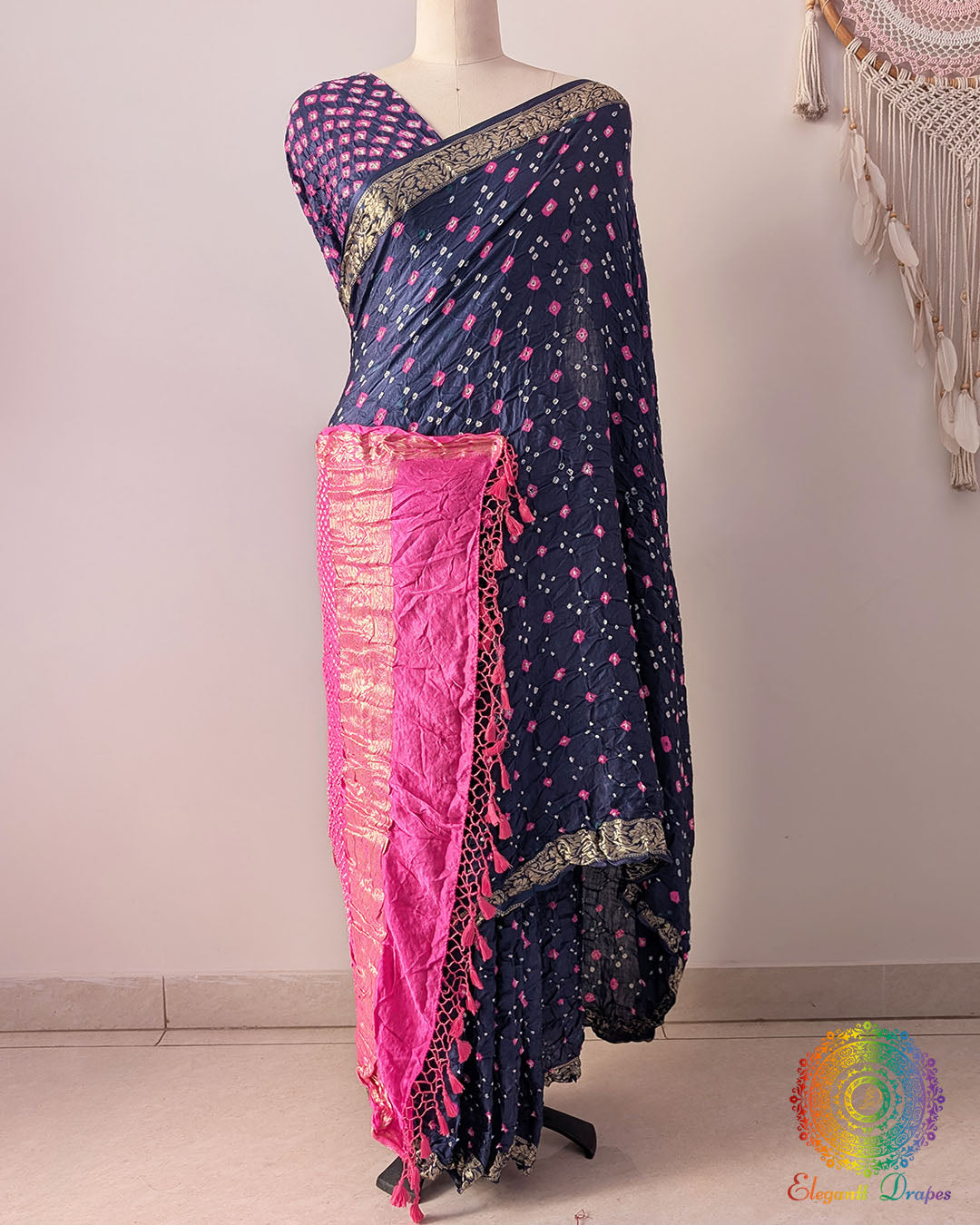 Navy blue gaji silk Bandhani saree showcasing elegant drape, baby pink palla, and Nakshi border