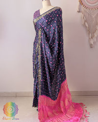 Baby pink palla on navy blue gaji silk saree highlighting Bandhani craftsmanship and Nakshi border