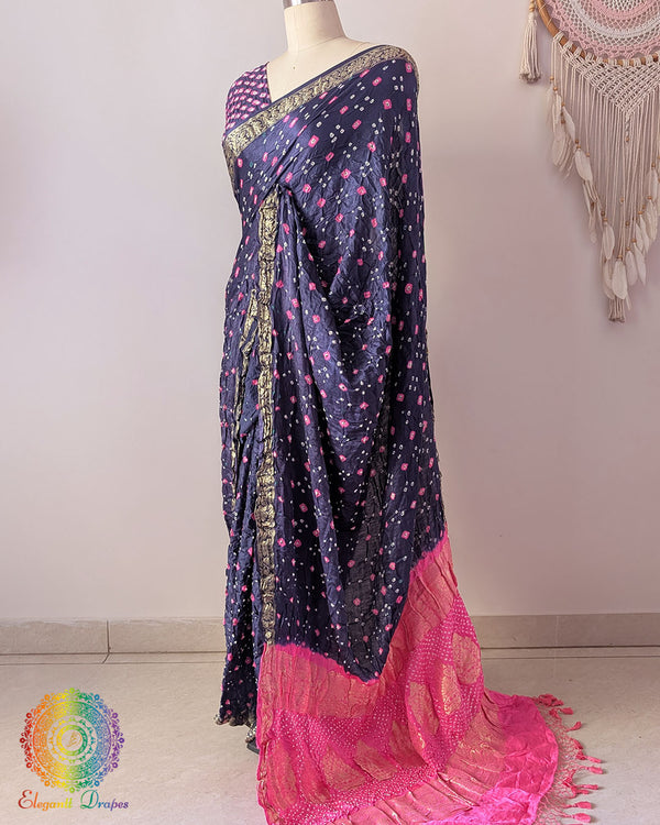 Baby pink palla on navy blue gaji silk saree highlighting Bandhani craftsmanship and Nakshi border
