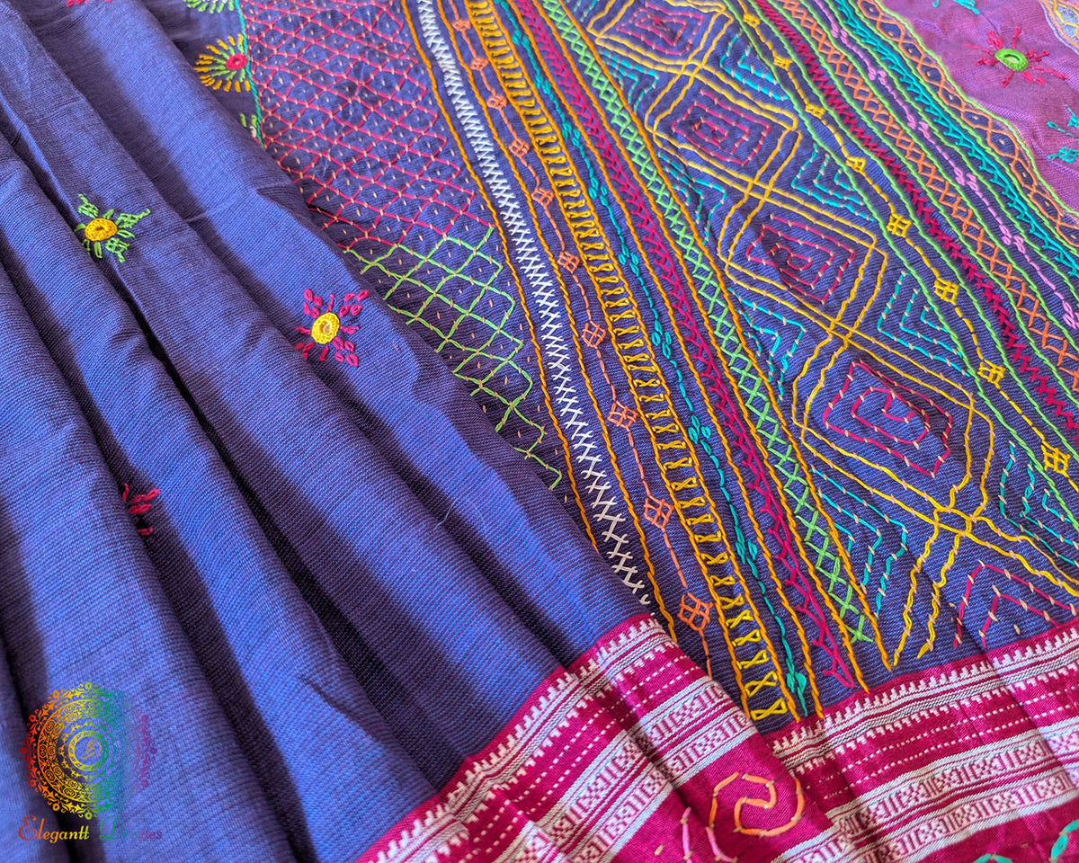 Detailed view of handcrafted Lambani embroidery on the blue Ilkal cotton saree
