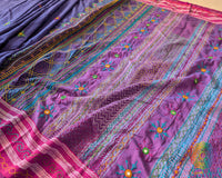 Close-up of intricate Lambani hand embroidery on the heavily embellished palla