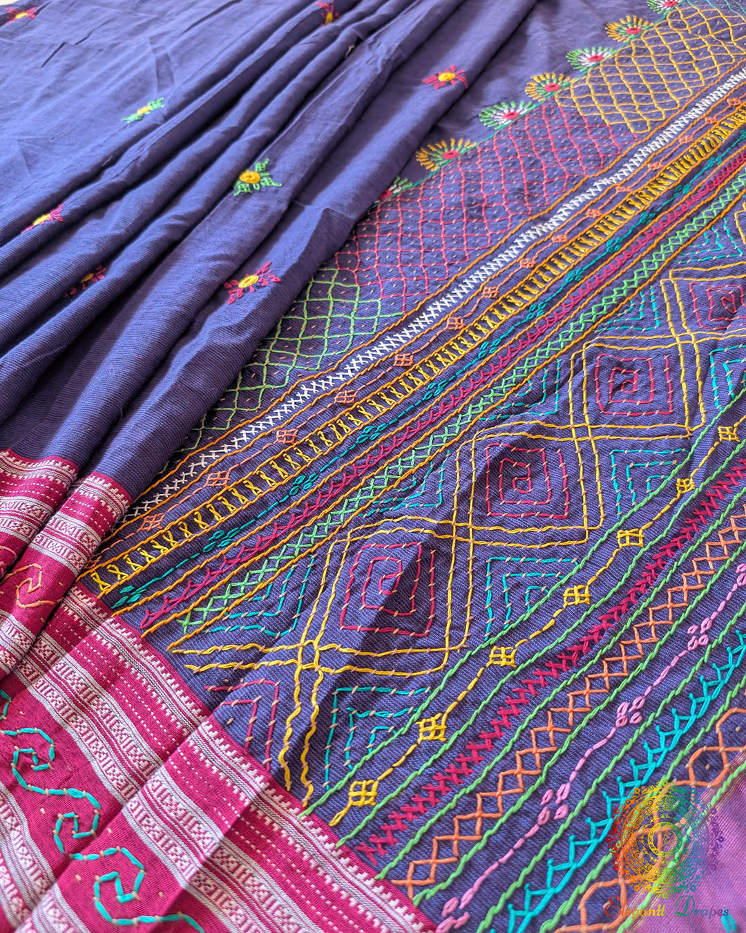 pleats of blue Ilkal cotton saree showcasing Lambani hand embroidery and elegant fall