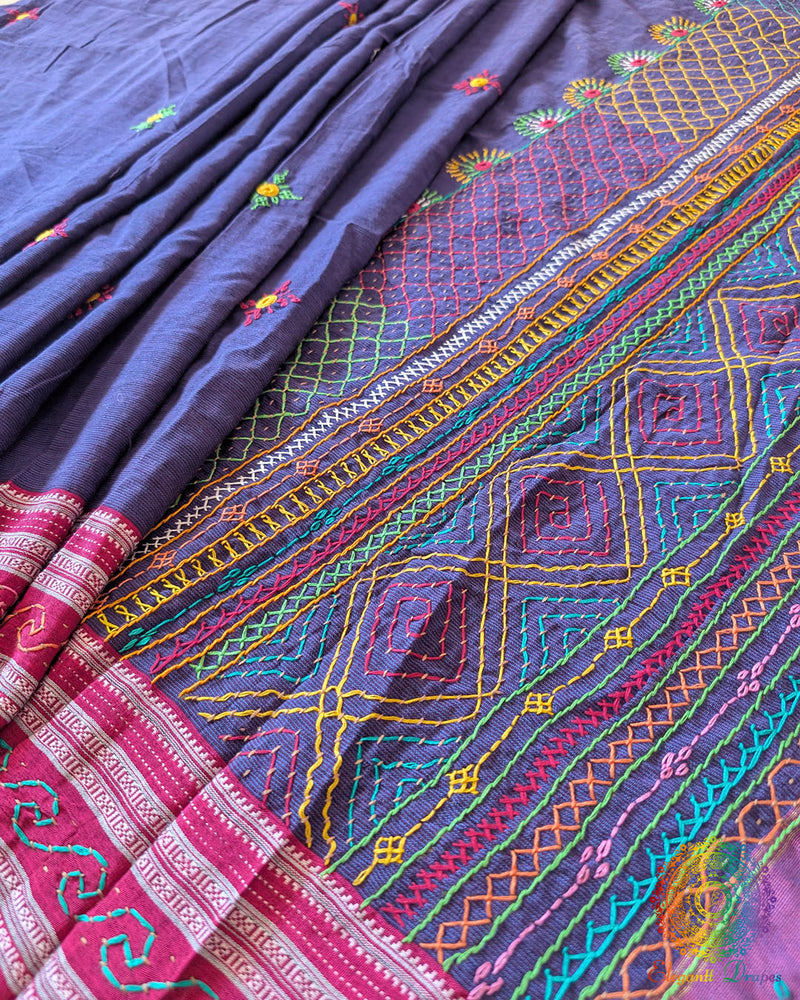 pleats of blue Ilkal cotton saree showcasing Lambani hand embroidery and elegant fall
