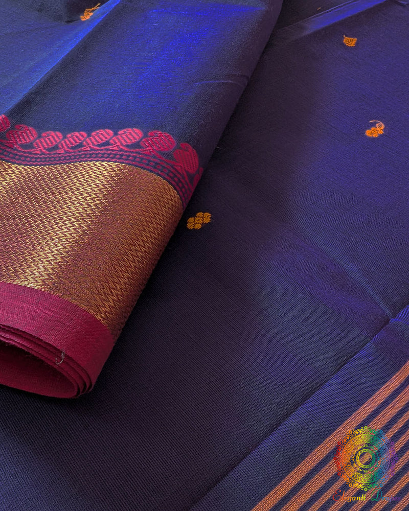 Blue Kanchi cotton saree border close up highlighting pink woven detailing and texture