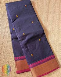 Folded blue pure Kanchi cotton saree showing pink border detail