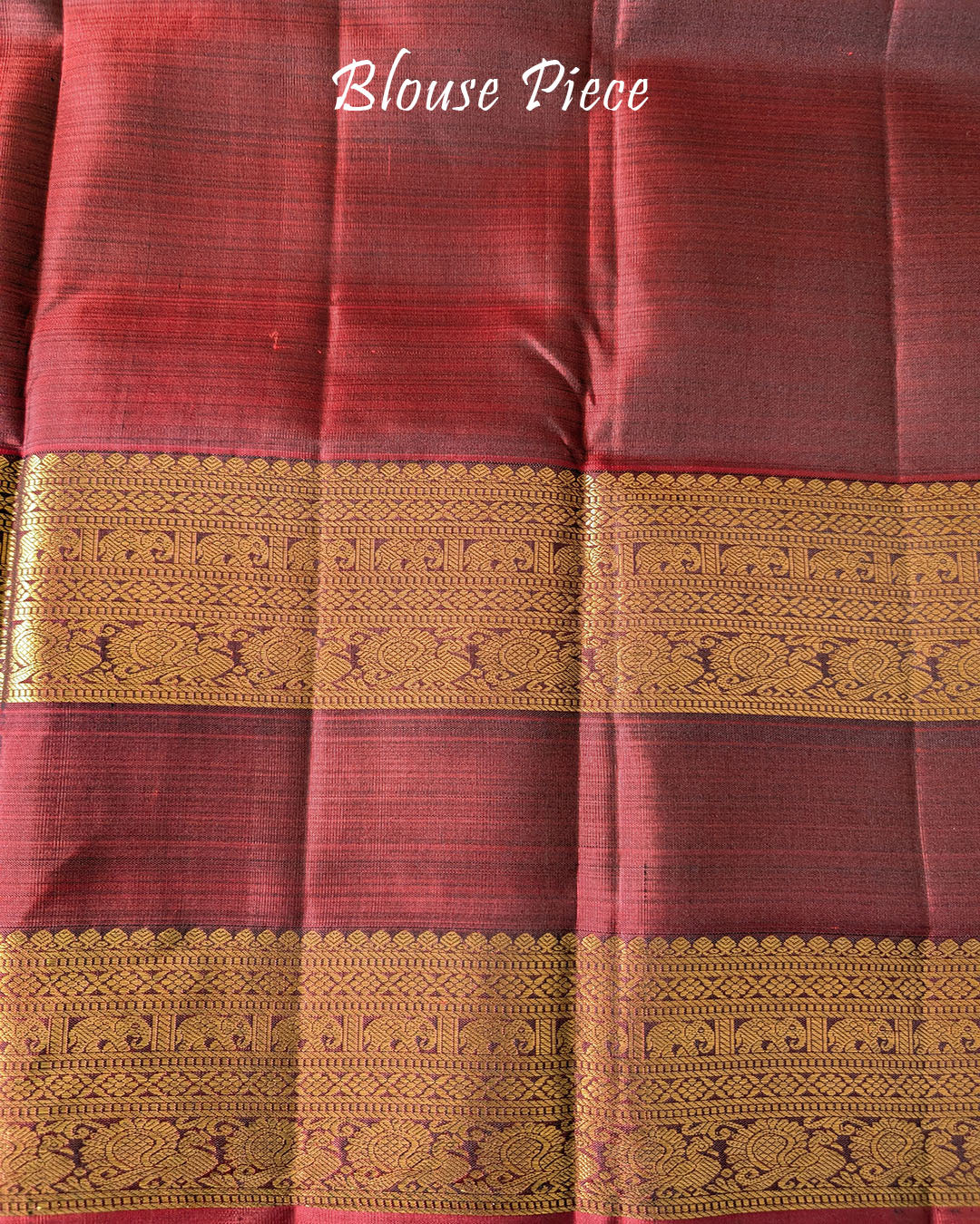 Matching blouse piece in navy blue Kanjivaram silk with zari detailing
