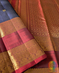Detailed view of woven zari motifs on red border of Kanjivaram silk saree