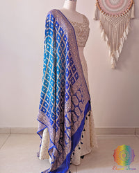 Side view of blue shaded Banarasi georgette Gharchola Bandhani dupatta showcasing elegant ombré shading, Gharchola checks, and Bandhani motifs