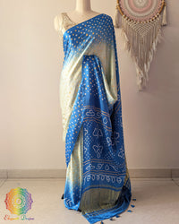 Blue shaded pure gaji silk saree with all-over bandhani dots on mannequin showing full drape