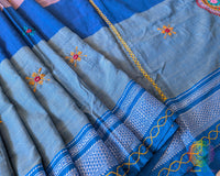 Close-up of intricate Lambani hand embroidery on the richly embellished palla