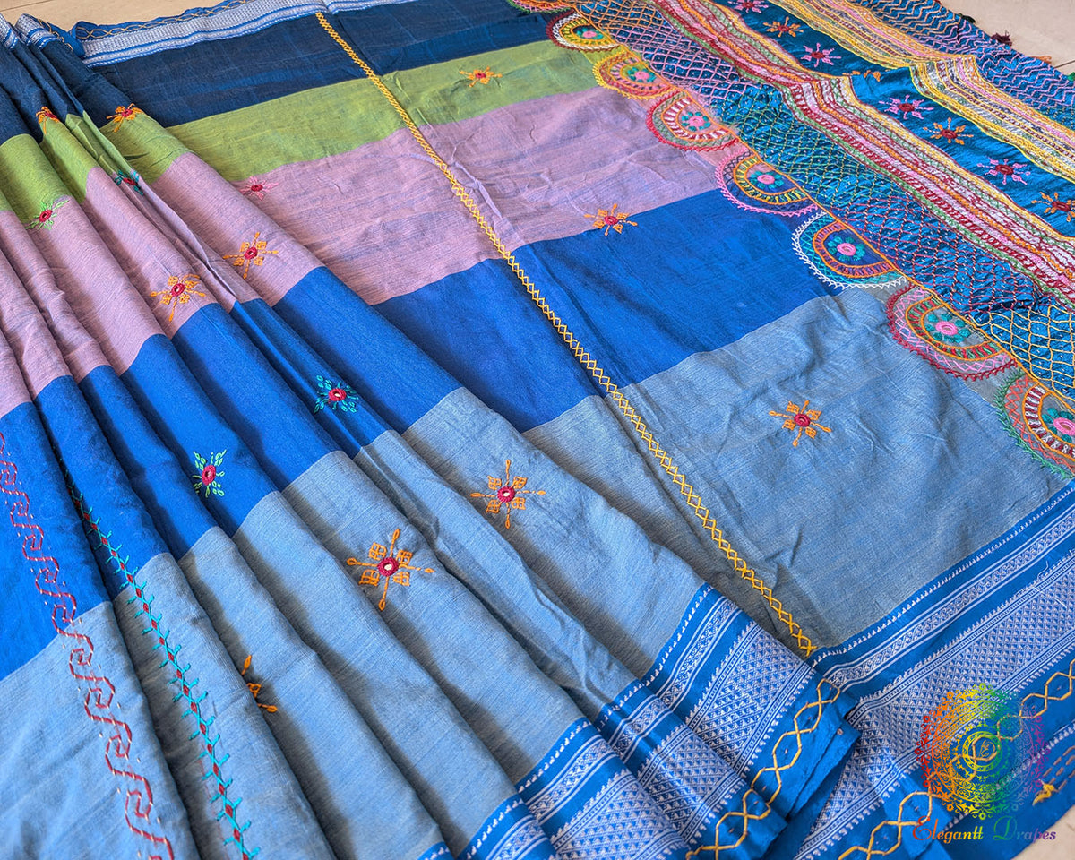 Steel blue Ilkal cotton saree highlighting striped body and handcrafted Lambani bootas