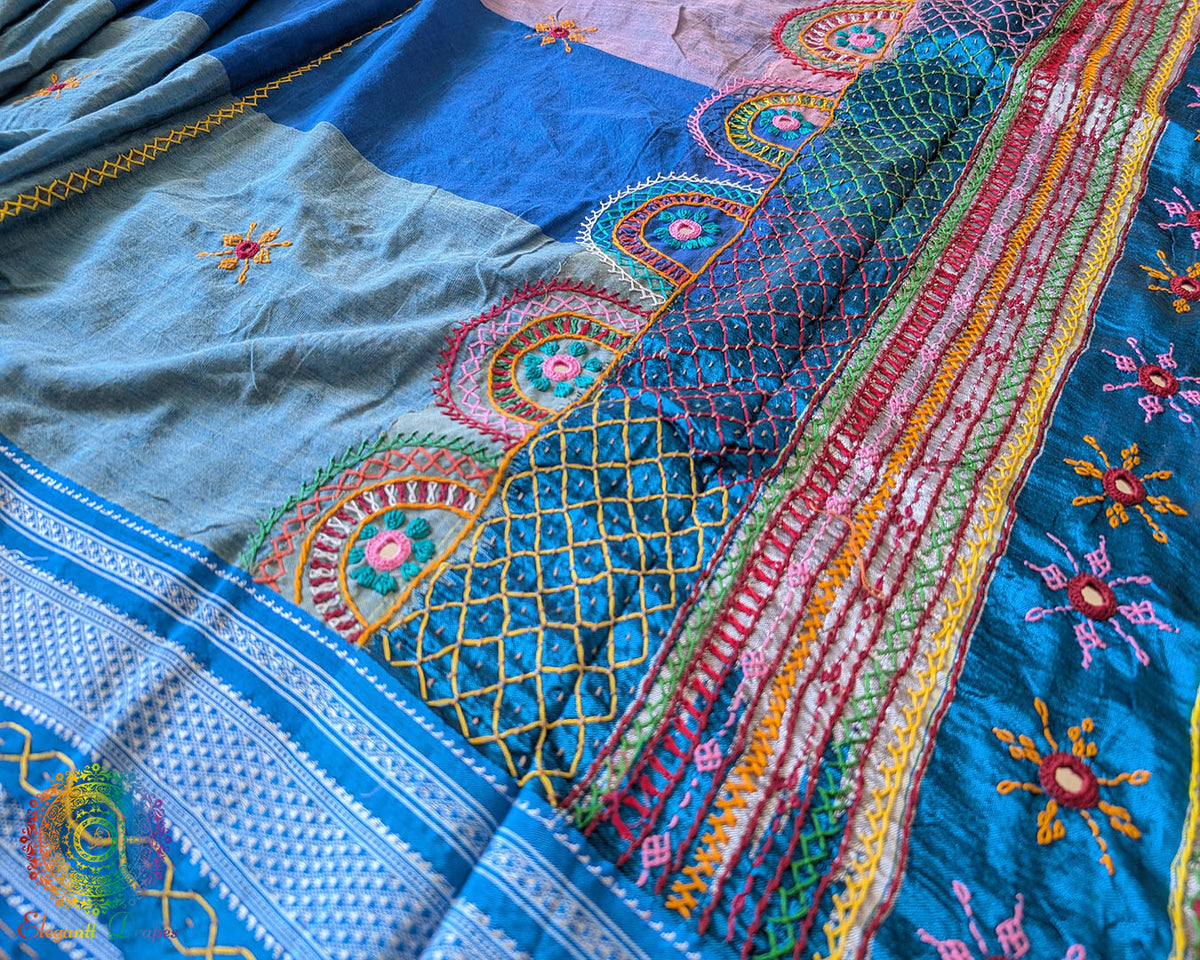 Side view of steel blue Ilkal cotton saree featuring traditional Lambani hand embroidery
