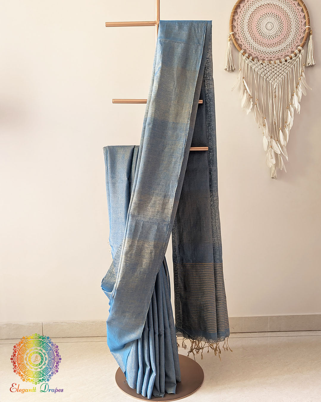 Blue Bengal linen tissue saree showing elegant drape and zari stripe palla