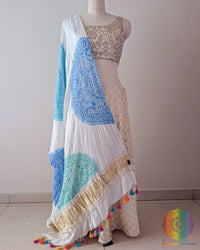 White Gajji Silk Blue Yellow Green Bandhani Dupatta displayed in a full draped view, showcasing the white base with vibrant blue, yellow and green Bandhani patterns.