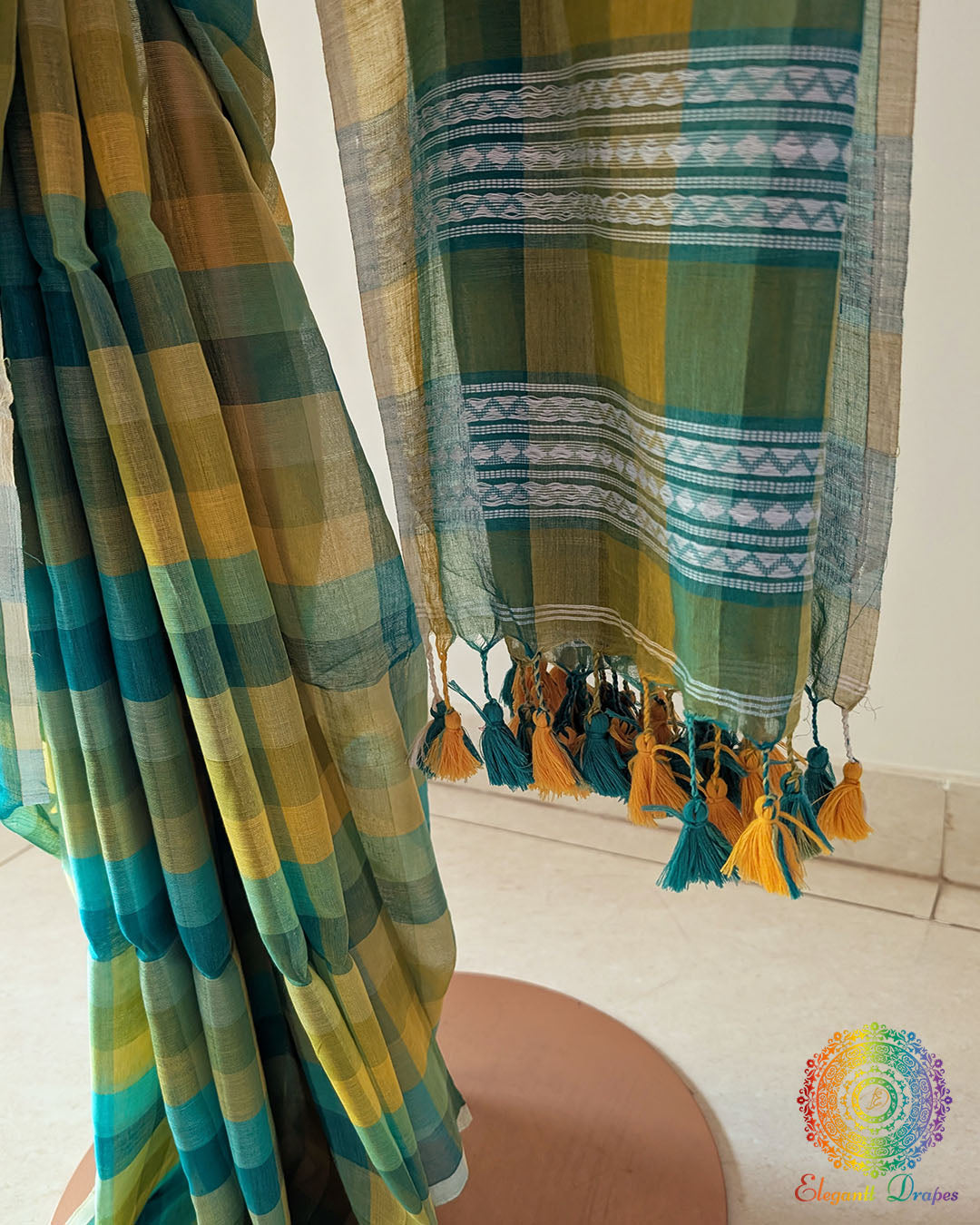 Intricately woven Jamdani palla on green and yellow Madras checks Bengal cotton saree