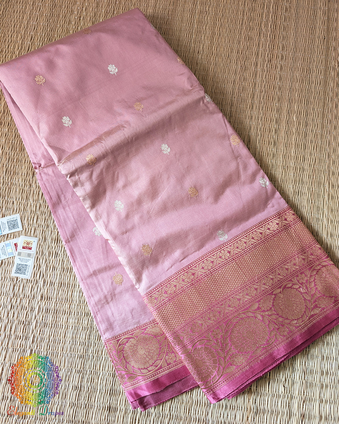 Folded blush pink Banarasi handloom Katan silk saree showing sona rupa zari weave