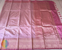 Full blush pink Banarasi Katan silk saree laid open showing overall woven design