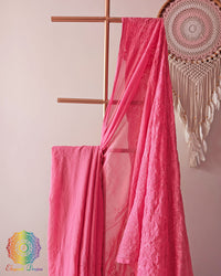 Blush pink cotton saree showcasing intricate paisley threadwork motifs