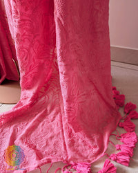 Detailed view of floral and paisley threadwork on blush pink cotton saree