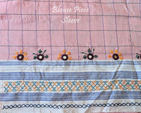Matching blouse sleeve featuring intricate handcrafted Lambani hand embroidery that highlights the fine artisan craftsmanship and coordinated design of the saree ensemble