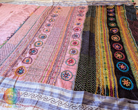 Pastel Blush Pink checked Ilkal cotton saree highlighting delicate Lambani embroidered bootas