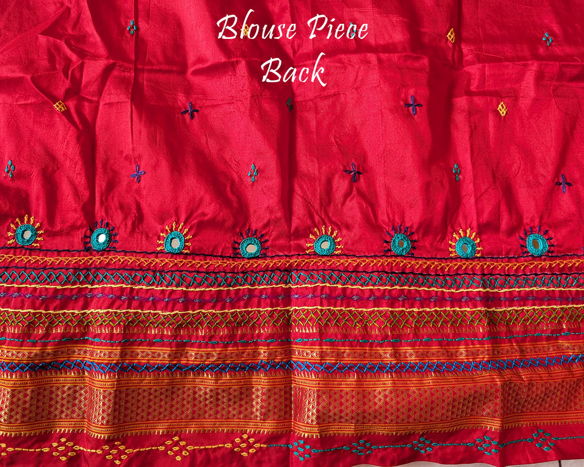 Matching blouse back showcasing traditional Lambani embroidery work on blush pink silk fabric