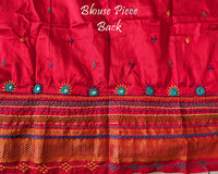 Matching blouse back showcasing traditional Lambani embroidery work on blush pink silk fabric
