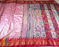 Blush pink pure Ilkal silk saree laid flat showcasing Lambani hand embroidery