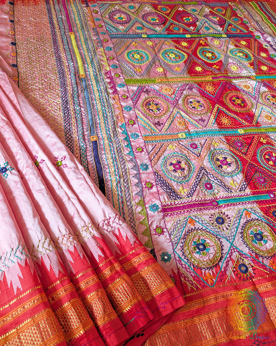 Lambani hand embroidery detail on blush pink Ilkal silk saree border