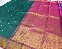 Bottle green Kanjivaram silk saree pallu view with traditional zari work