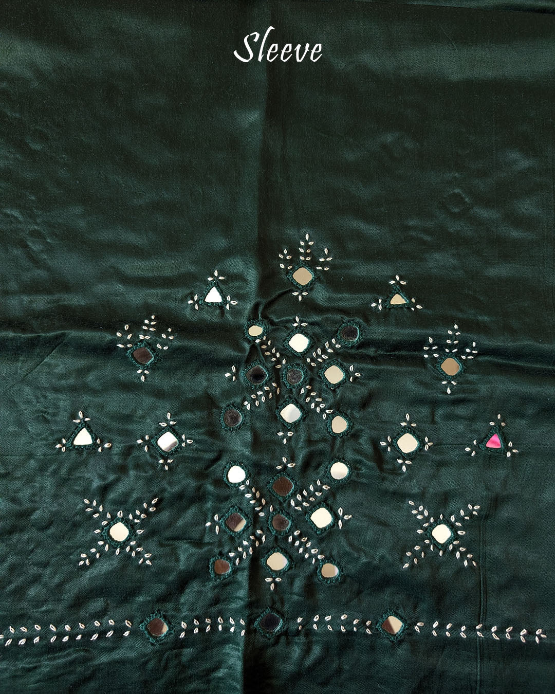 Close-up of Kutch mirror embroidery on sleeve of Bottle Green Mashru Silk Blouse Piece