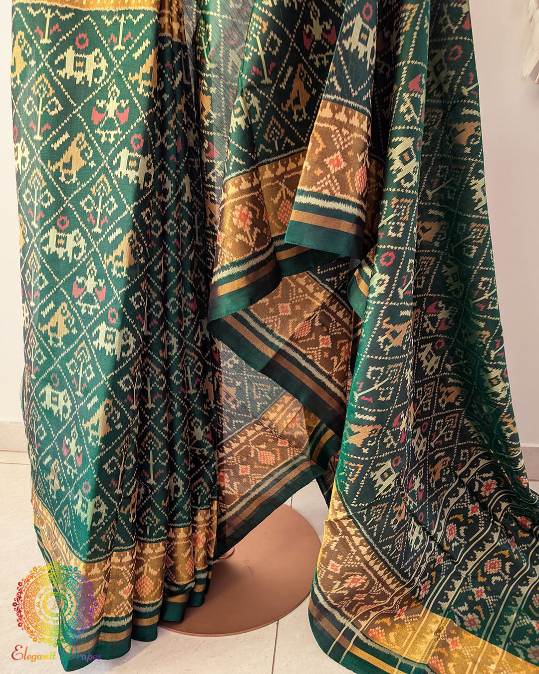 Bottle green pure mulberry silk Rajkot Patola saree pleats