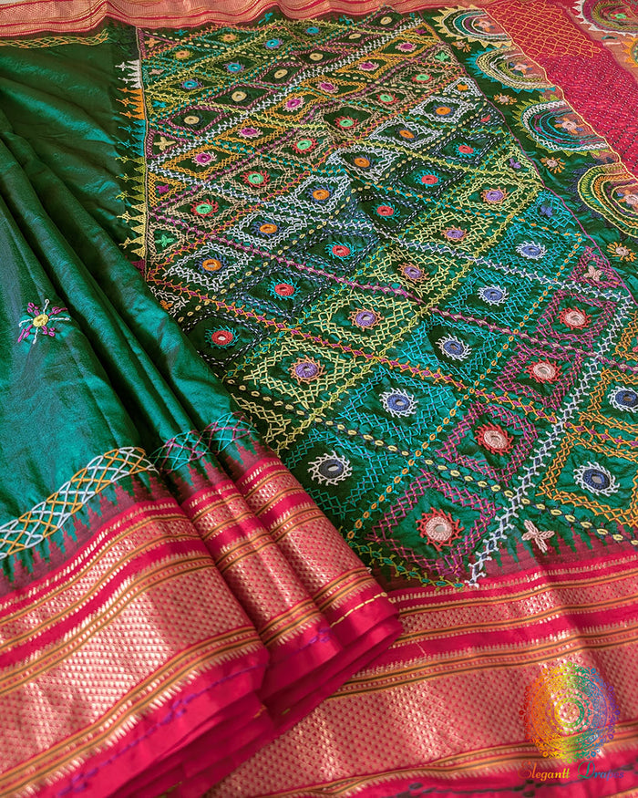 Bottle green pure Ilkal silk saree laid open showing overall design and drape