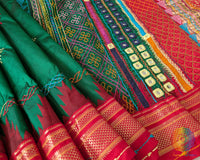 Close-up of the Sindur Lambani handwork on the Deep Green Pure Ilkal Silk Saree, highlighting the decorative threadwork and handcrafted folk-art patterns.