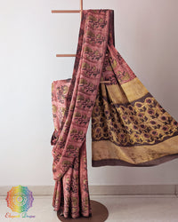 Brick Red Nashpal Pomegranate Ajrakh Modal Tussar Saree with the palla neatly pleated, highlighting the layered pattern and earthy red tones of the textile.