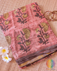Brick Red Nashpal Pomegranate Ajrakh Modal Tussar Saree folded to showcase its deep brick red shade, distinctive Nashpal Pomegranate Ajrakh print and striped pattern.