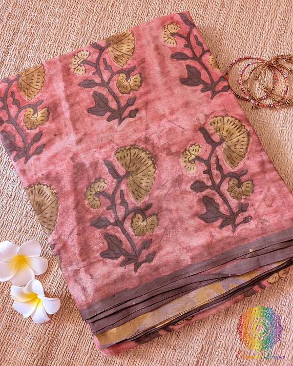 Brick Red Nashpal Pomegranate Ajrakh Modal Tussar Saree folded to showcase its deep brick red shade, distinctive Nashpal Pomegranate Ajrakh print and striped pattern.
