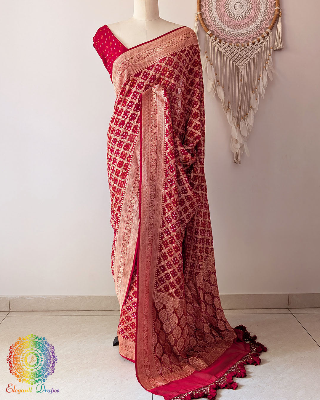 Bridal red Khaddi georgette Banarasi Bandhani saree highlighting the Banarasi woven palla and handcrafted heavy tassels