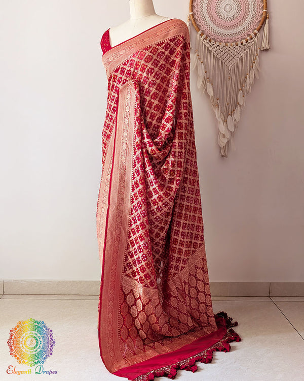 Side view of bridal red Khaddi georgette Banarasi Bandhani saree showcasing elegant drape