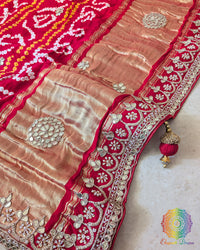 Bridal Red Gaji Silk Gharchola Saree with the palla visible in a draped view, displaying the traditional Gharchola patterns and decorative golden Gota Patti work.