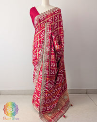 Bridal Red Gaji Silk Gharchola Saree with Gota Patti Work in a front drape view, showcasing the rich bridal red colour, traditional Gharchola design and golden hand embellishments.