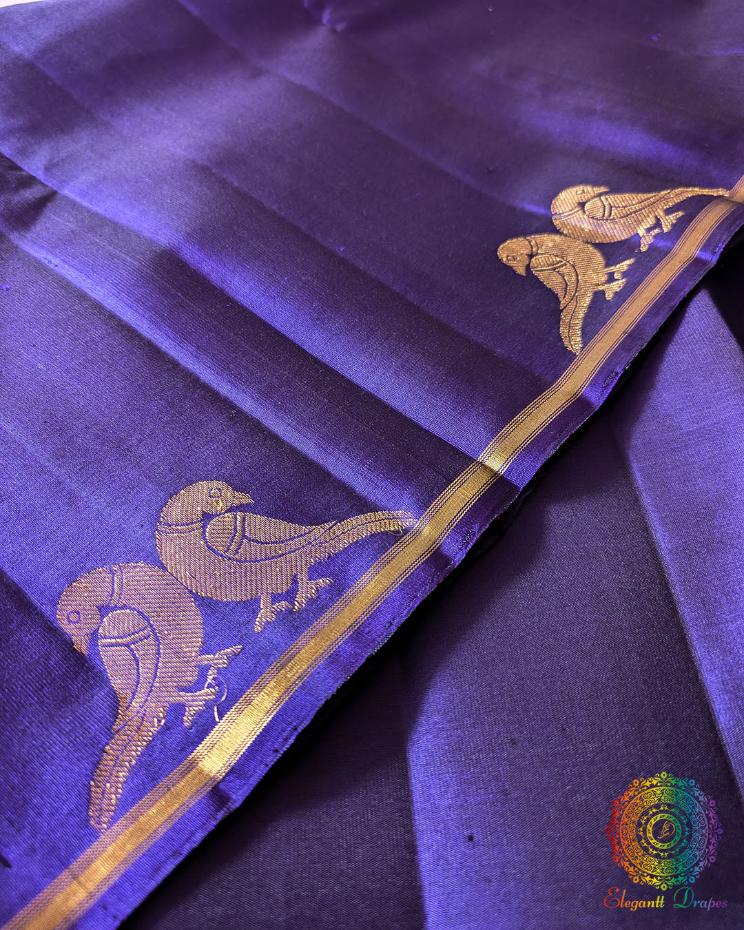 Close-up of pair of peacock motifs on the borderless Brinjal Kanjivaram Silk Saree