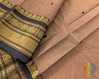 Close up of border on brown Kanchi cotton saree highlighting weave detail